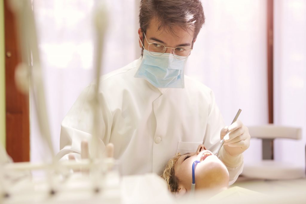 A dentist working on a patient.